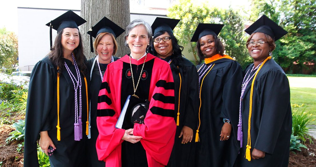 President McClure and students at Commencement